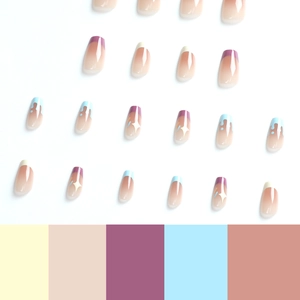 Cute blue and purple French press-on nails with white stars and drips on nude base