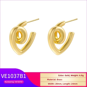 Detailed macro view of hollow water drop earrings in 18K gold plated brass finish