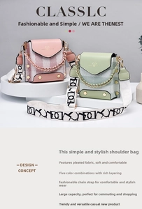 Detail view of pink and green pleated handbags with stylish patterned wide shoulder straps
