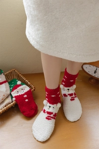 Detailed view of thick Christmas coral fleece socks with cute cartoon bear character