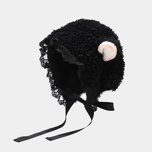 Cute black plush lamb ear hat with delicate lace trim and satin ribbons for winter
