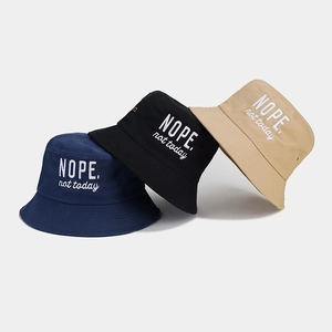 Three-piece set of embroidered bucket hats in navy, black, and khaki cotton fabric