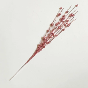 Detail showing artificial pink glitter berry stems for Christmas tree decorations