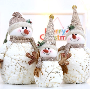Three plush Christmas snowman figurines in white and champagne gold for holiday decor
