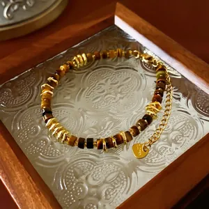 Maillard style tiger eye bead bracelet with gold metal accents and a heart charm