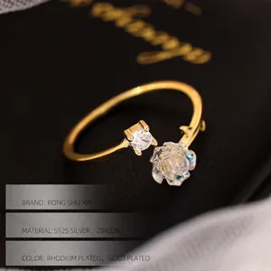 Elegant S925 silver open ring featuring a gold camellia flower and sparkling zircon stone