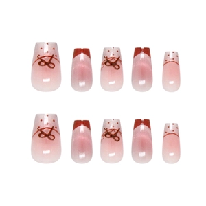 Roze gradiënt kunstnagels met rode French tips en handgeschilderde strikjes ontwerpen