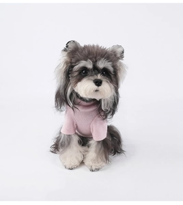 Detailed view of pink fleece pet sweater fabric and high collar design for small dogs