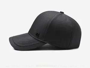 Detail view of cotton baseball cap showing side musical note emblem and stitching