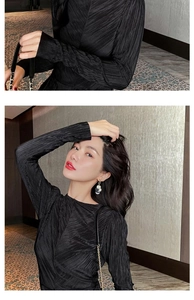 Close-up of elegant black and white color-block tassel earrings worn by a fashion model