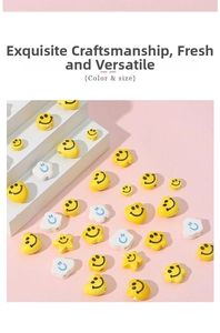Detailed view of yellow heart and star shaped ceramic smile face beads for DIY jewelry