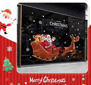 Detailed Christmas window decals showing Santa on sleigh and reindeer on glass pane