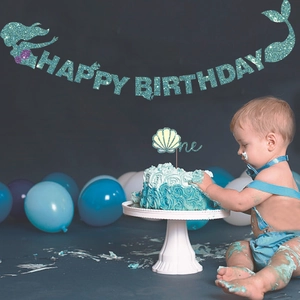 Sparkling blue mermaid Happy Birthday banner and shell cake topper for first birthday party