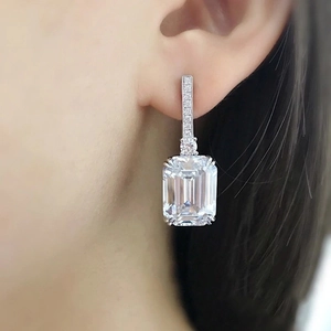 Elegant emerald cut cubic zirconia drop earrings with silver prong setting and sparkles
