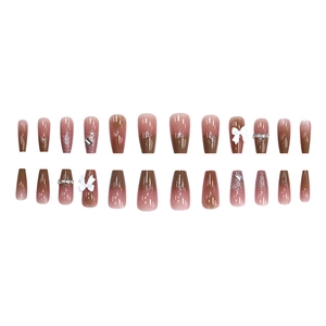 Brown ombre long trapezoid press-on nails with white 3D bows and shimmering rhinestones