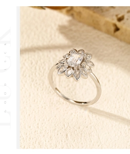 Macro shot of S925 sterling silver ring with a radiant rectangular center stone and petal halo