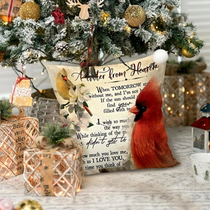 Christmas cushion cover with red cardinal and memorial poem near a festive tree