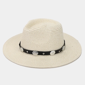 Close-up of cream woven straw fedora hat with silver-studded black leather band decor