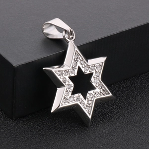 Hip hop silver hexagram star pendant with diamonds on a black textured background