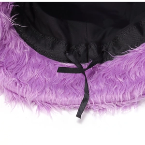 Detail of purple faux fur bucket hat showing black inner lining and adjustable drawstring