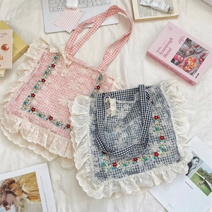 Detailed embroidery on floral lace canvas tote bag with rustic plaid pattern finish