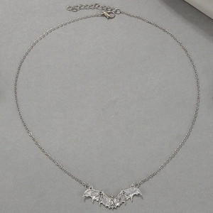 Punk style silver bat pendant necklace with detailed vintage texture and fine chain for women