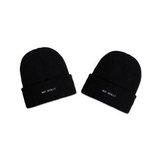 Two black NOT REALLY knit beanies with cuffed design for winter warmth and daily style