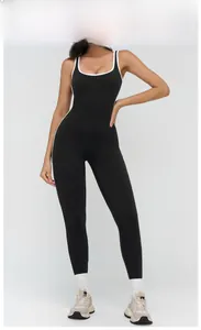 Close-up of black yoga bodysuit featuring white contrast binding and square neckline