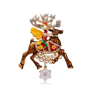 Christmas reindeer brooch with enamel elf and snowflake charm in golden metal finish