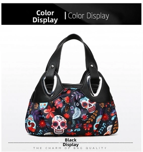 Detail of floral skull print on black nylon handbag with silver metal buckle