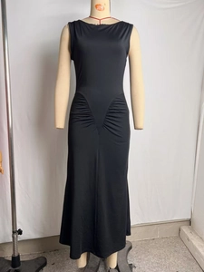 Detail view of ruched hip design on a slim fit black sleeveless long dress with mermaid hem
