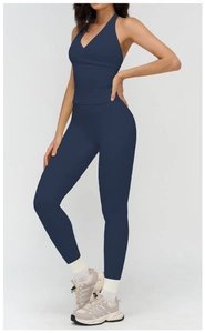 Detail view of navy blue yoga set with hollow back top and high-waisted leggings