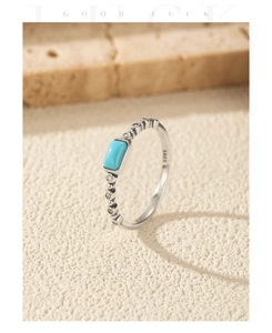 Macro detail of S925 sterling silver ring with turquoise stone and beaded texture