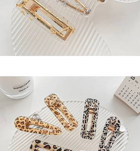 Detail of leopard print and gold foil acrylic hair clips with metal duckbill back