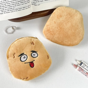 Close-up of funny potato expression plush coin purse with soft brown fabric and zipper