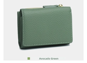 Macro detail of jade green pebble grain leather wallet with contrast white stitching