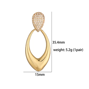 Detail of gold geometric hollow earrings with diamond accents and dimensions measurement