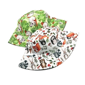 Double-sided sun hat with tropical leaf and forest animal prints for outdoor protection