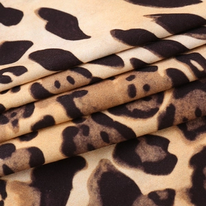 Detail shot of leopard print fabric showing smooth texture and drape of the leopard top
