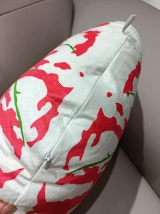 Detail of invisible zipper and soft plush fabric on cartoon leaf patterned throw pillow