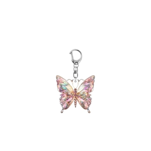 Iridescent acrylic butterfly keychain with pink and purple textures on a white background
