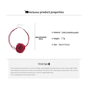 Detail view of a 40cm red fabric rose choker with pearls and sizing measurements