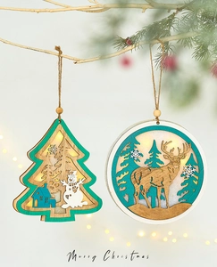 Detail of wooden LED Christmas ornaments with reindeer and tree glowing on branches