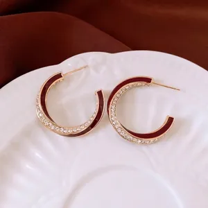 18K gold plated twisted hoop earrings with burgundy enamel and sparkling zircons