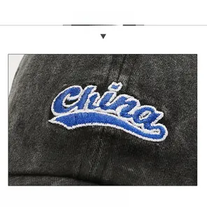 Detailed view of the China letter embroidery and washed denim texture on the baseball cap