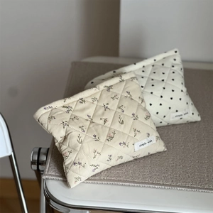 Quilted corduroy cosmetic bags featuring floral and heart patterns with simple wish labels