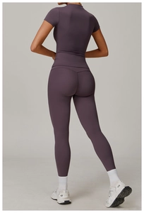 Back view of high-waisted deep purple yoga set showing slim fit and stretchy fabric