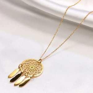 Golden dreamcatcher necklace with hollow flower design and four feather pendants on silk
