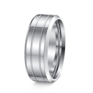 Close-up of silver stainless steel ring featuring parallel groove design and polished finish