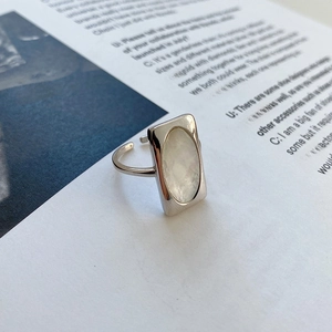 Macro detail of S925 silver ring featuring an oval white shell inlay on an open band